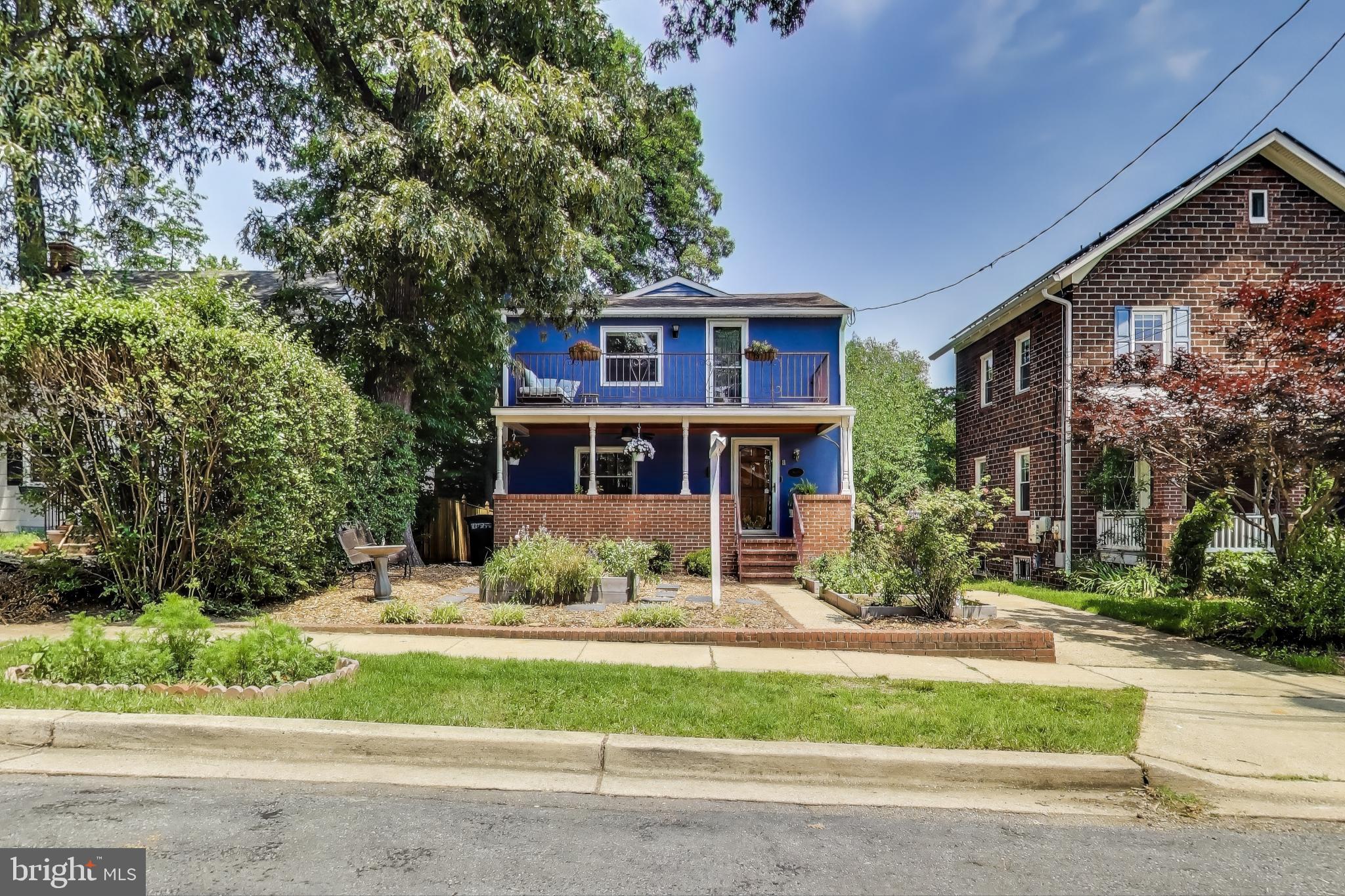 805 Islington Street Silver Spring, MD 20910 - Photo 2 of 50 a front view of a house with a yard