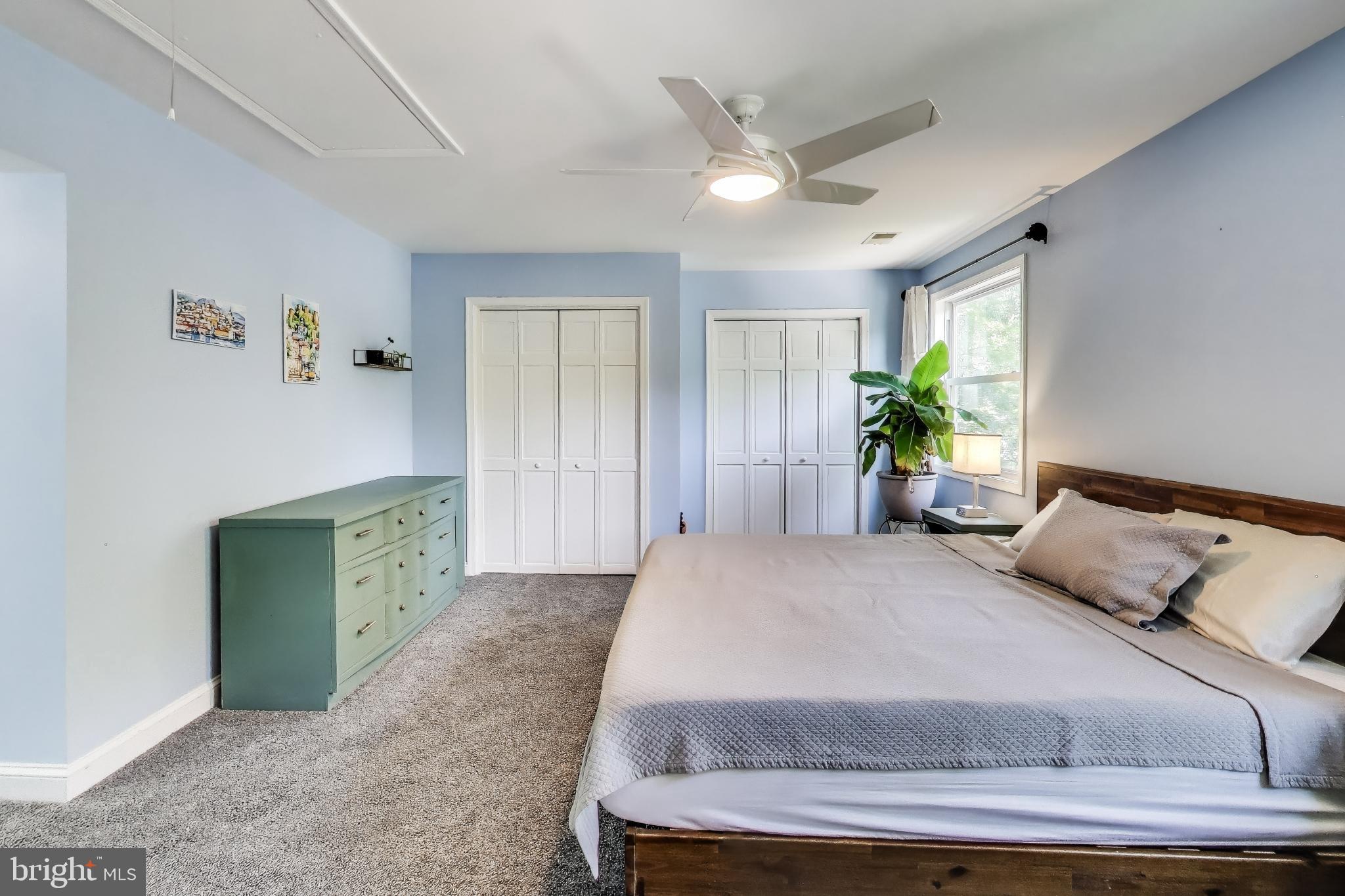 805 Islington Street Silver Spring, MD 20910 - Photo 23 of 50 a bedroom with a bed and a chandelier