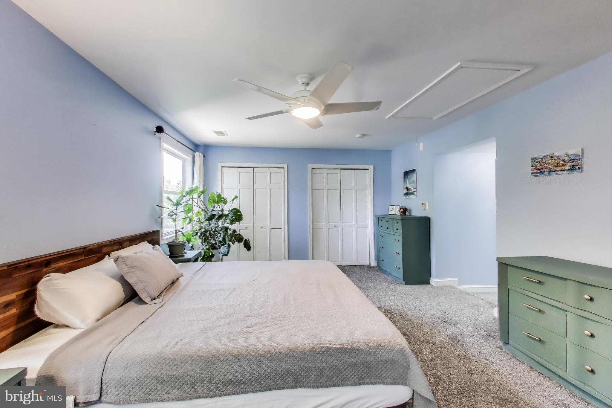 805 Islington Street Silver Spring, MD 20910 - Photo 24 of 50 a bedroom with a large bed and a dresser