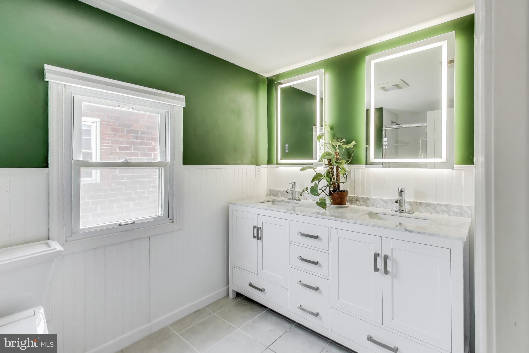805 Islington Street Silver Spring, MD 20910 - Photo 25 of 50 a bathroom with a granite countertop sink and a mirror