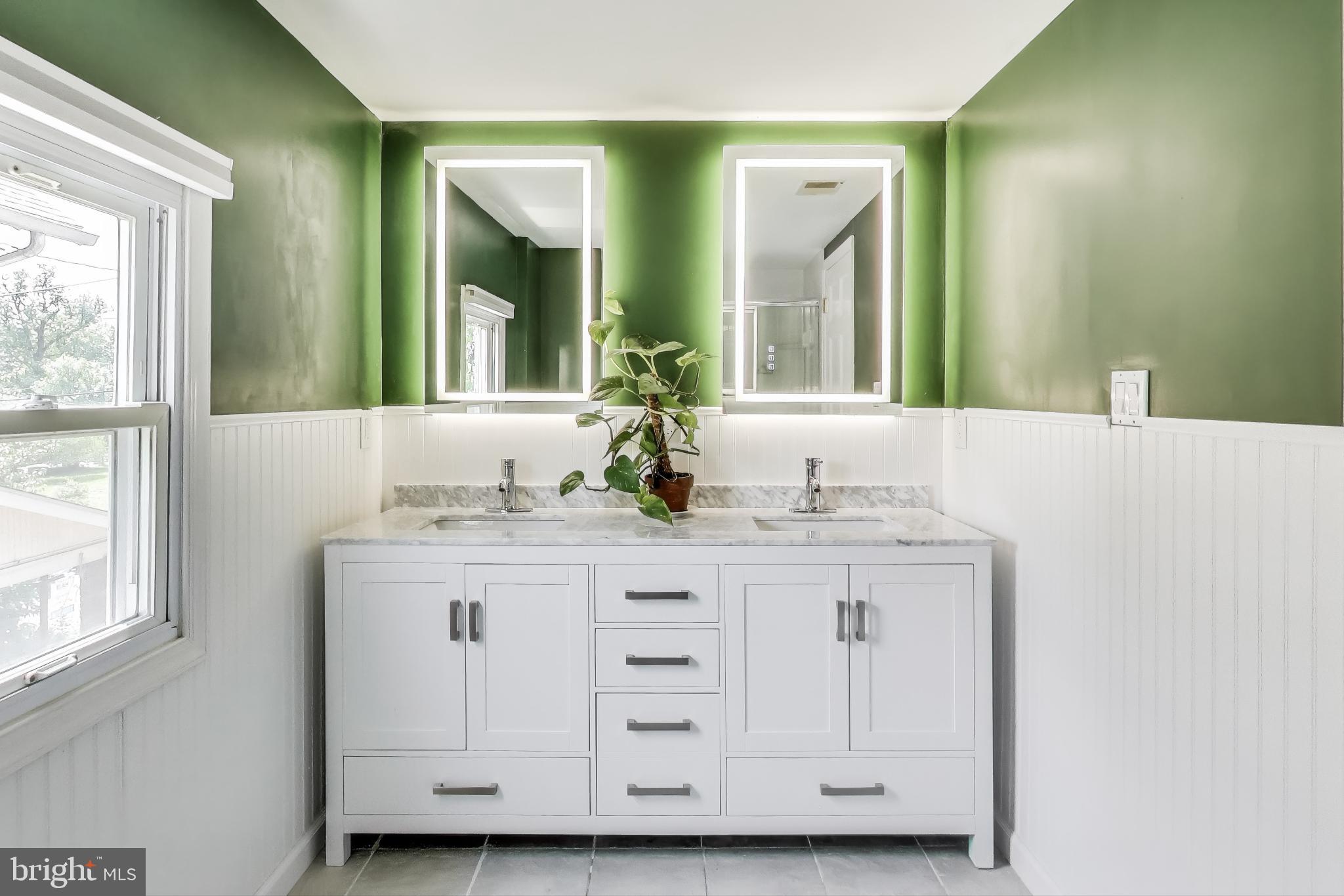 805 Islington Street Silver Spring, MD 20910 - Photo 26 of 50 a bathroom with a granite countertop sink and a mirror
