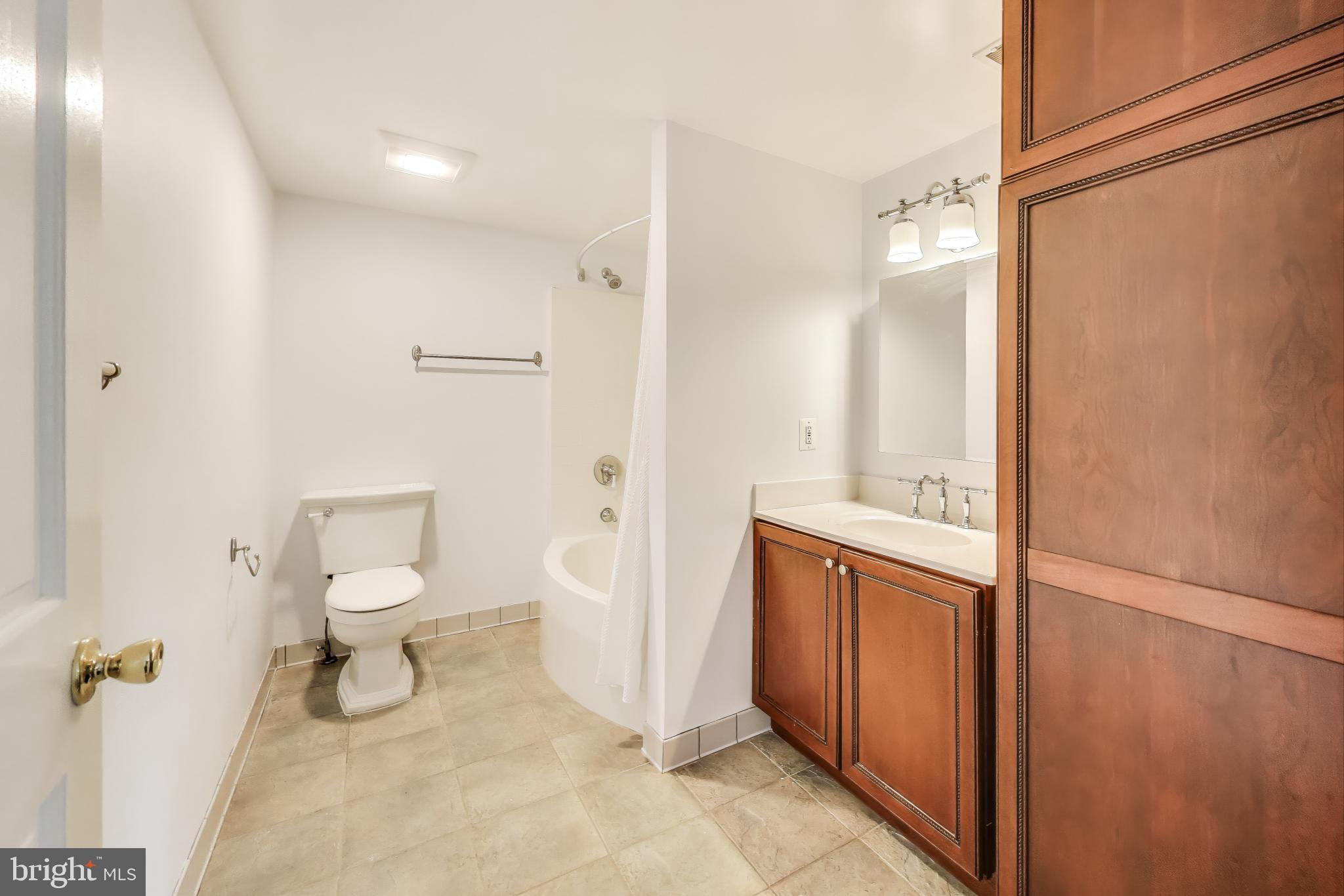 805 Islington Street Silver Spring, MD 20910 - Photo 30 of 50 a bathroom with a sink a toilet and shower