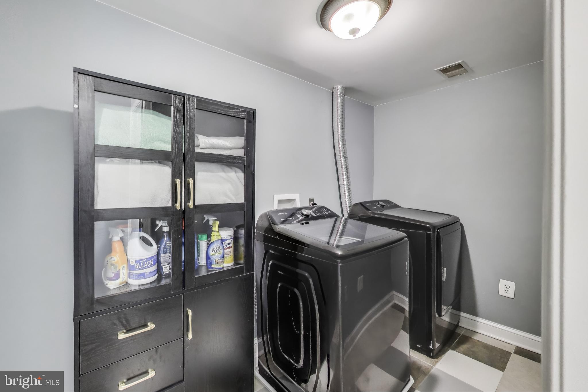 805 Islington Street Silver Spring, MD 20910 - Photo 35 of 50 a utility room with multiple dryer and washer