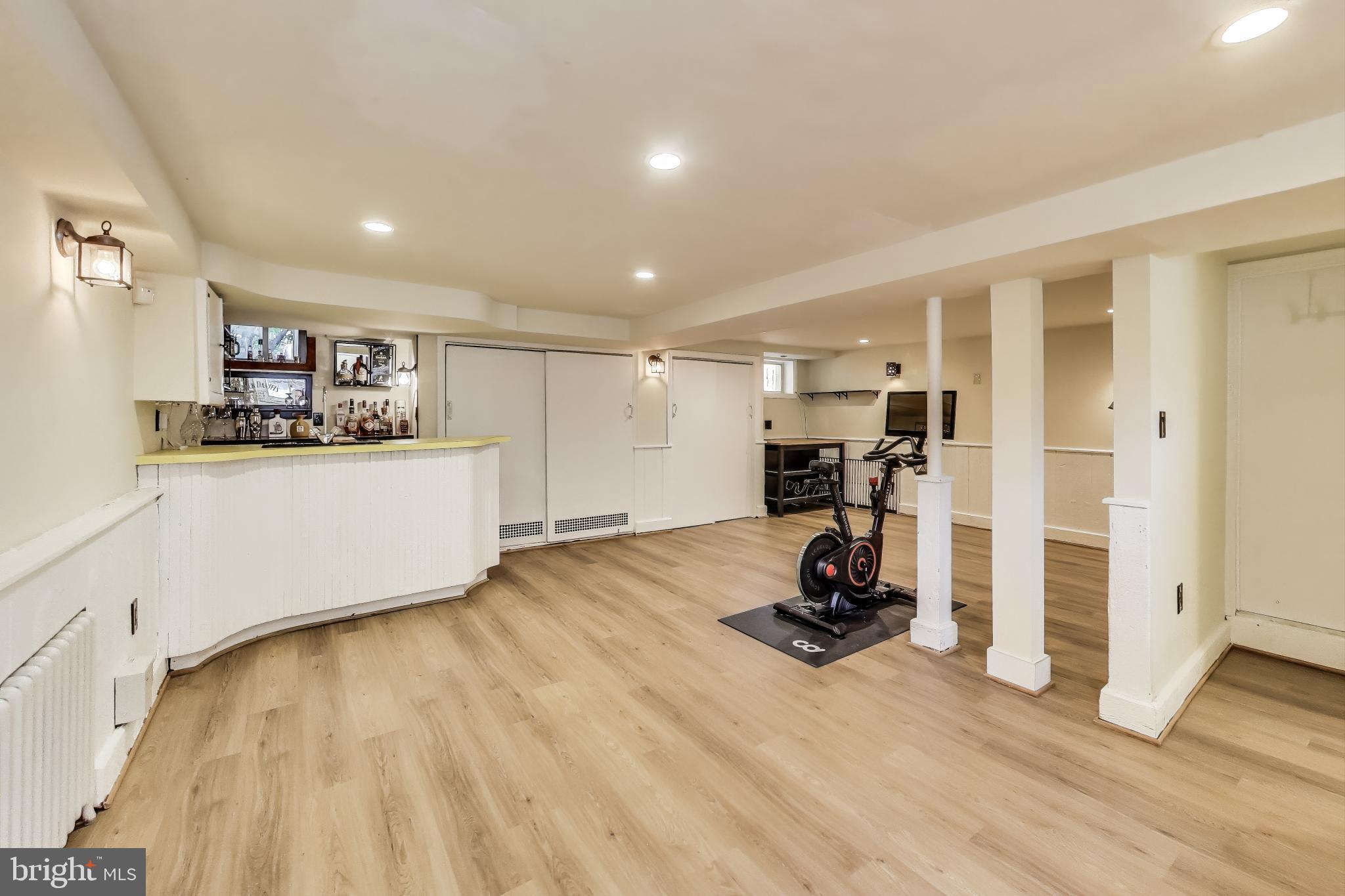 805 Islington Street Silver Spring, MD 20910 - Photo 36 of 50 a view of a room with gym equipment and a wooden floor