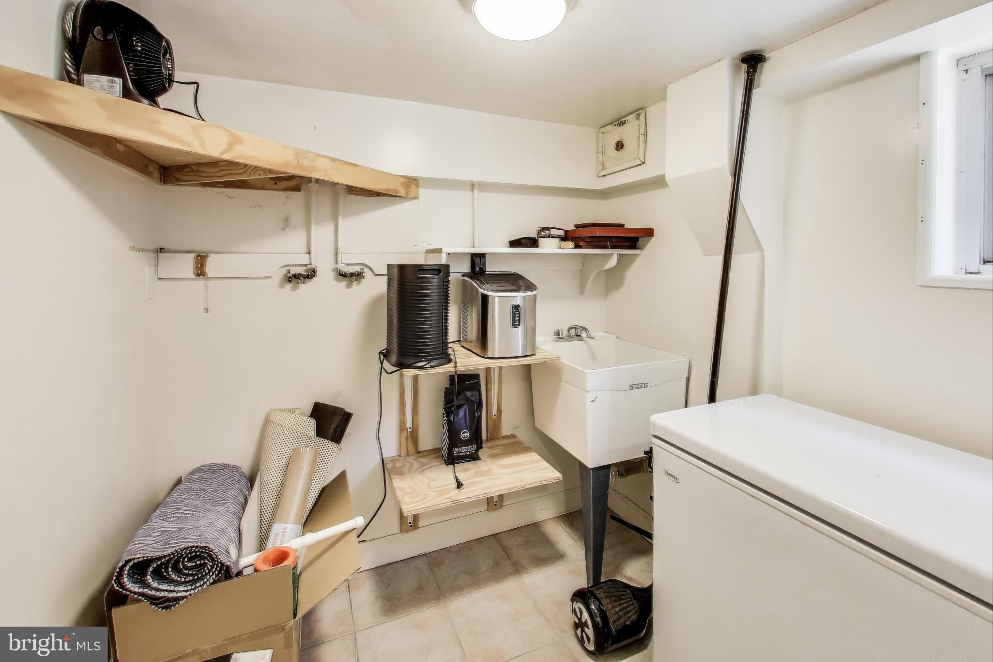 805 Islington Street Silver Spring, MD 20910 - Photo 42 of 50 a view of a storage & utility room with washer and dryer
