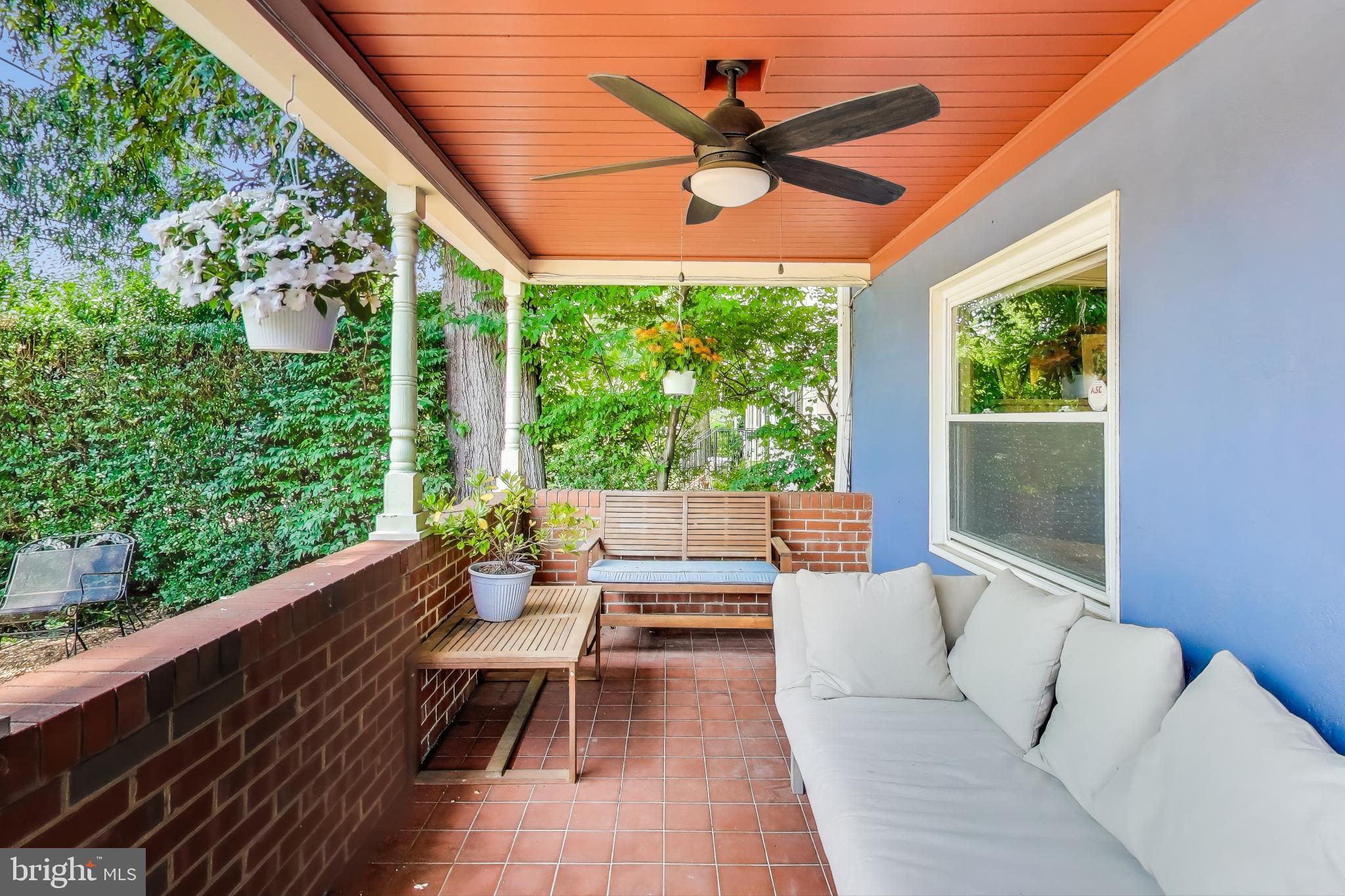 805 Islington Street Silver Spring, MD 20910 - Photo 5 of 50 a living room with large windows and a table
