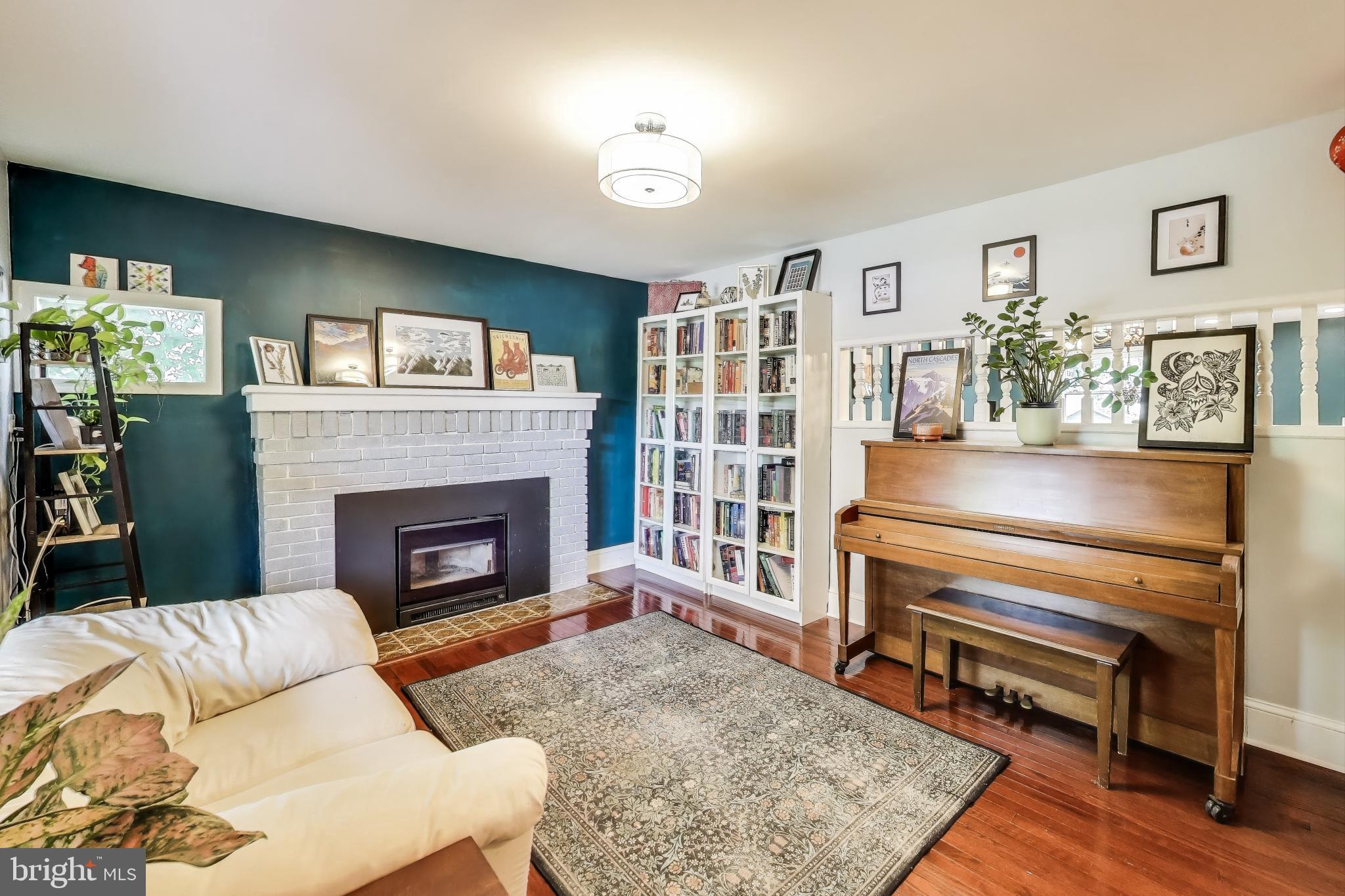 805 Islington Street Silver Spring, MD 20910 - Photo 7 of 50 a living room with furniture and a fireplace