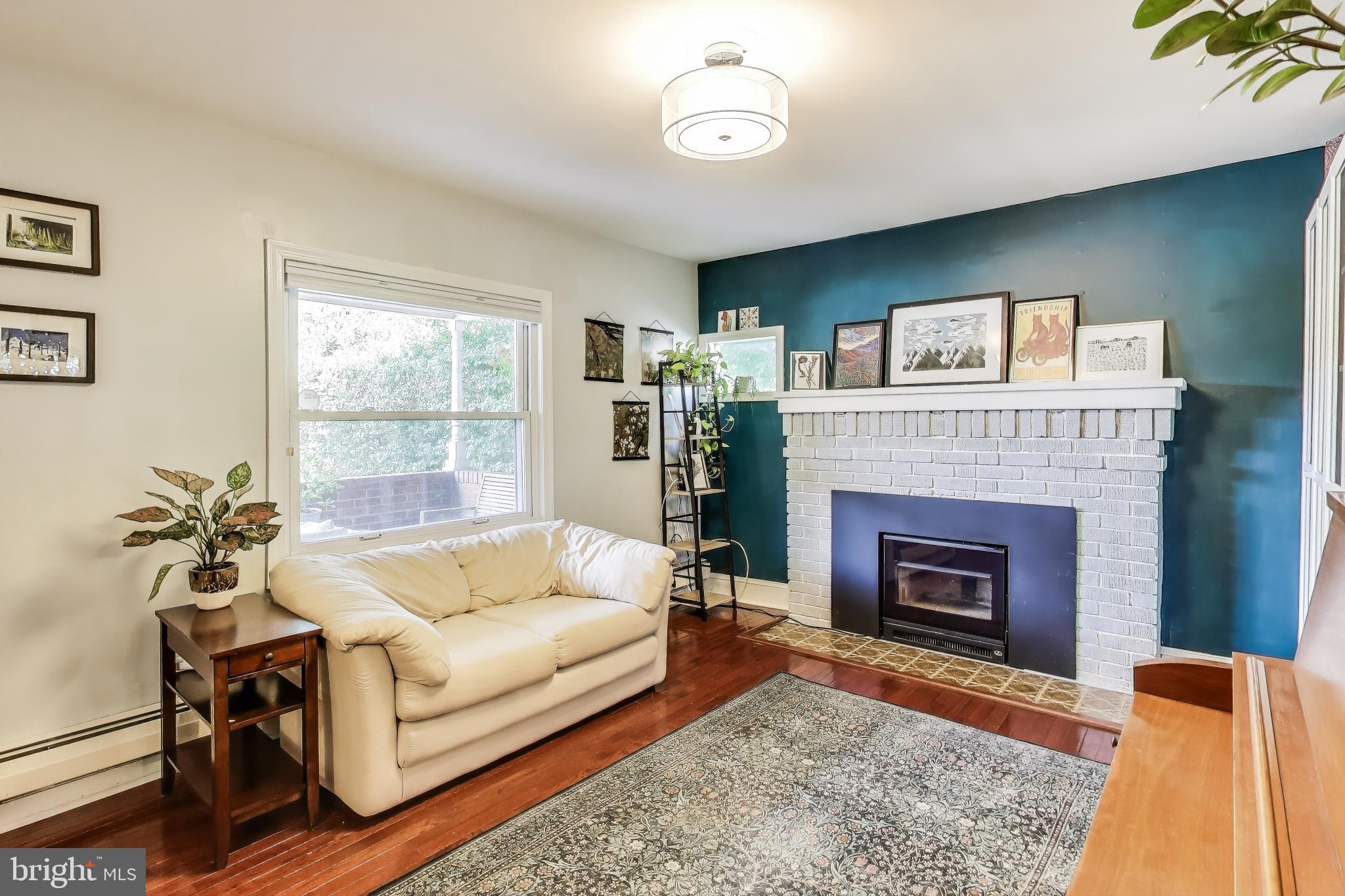 805 Islington Street Silver Spring, MD 20910 - Photo 8 of 50 a living room with furniture and a fireplace