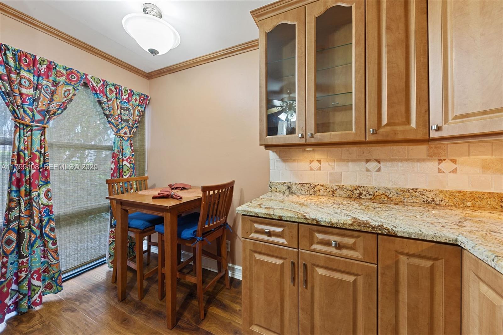 6668 Burning Wood Drive, Unit 166 Boca Raton, FL 33433 - Photo 16 of 27 a kitchen with a sink and cabinets
