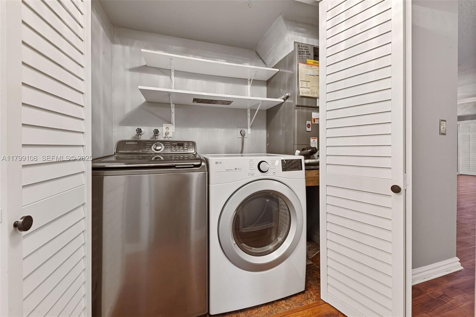 6668 Burning Wood Drive, Unit 166 Boca Raton, FL 33433 - Photo 17 of 27 a utility room with dryer and washer