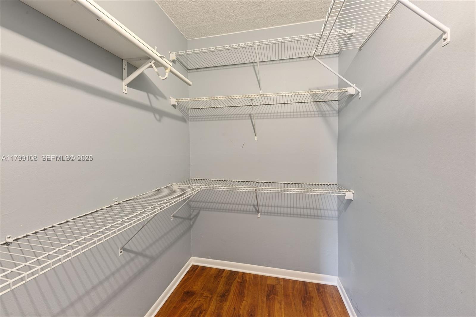 6668 Burning Wood Drive, Unit 166 Boca Raton, FL 33433 - Photo 20 of 27 a view of a room with racks on the wall