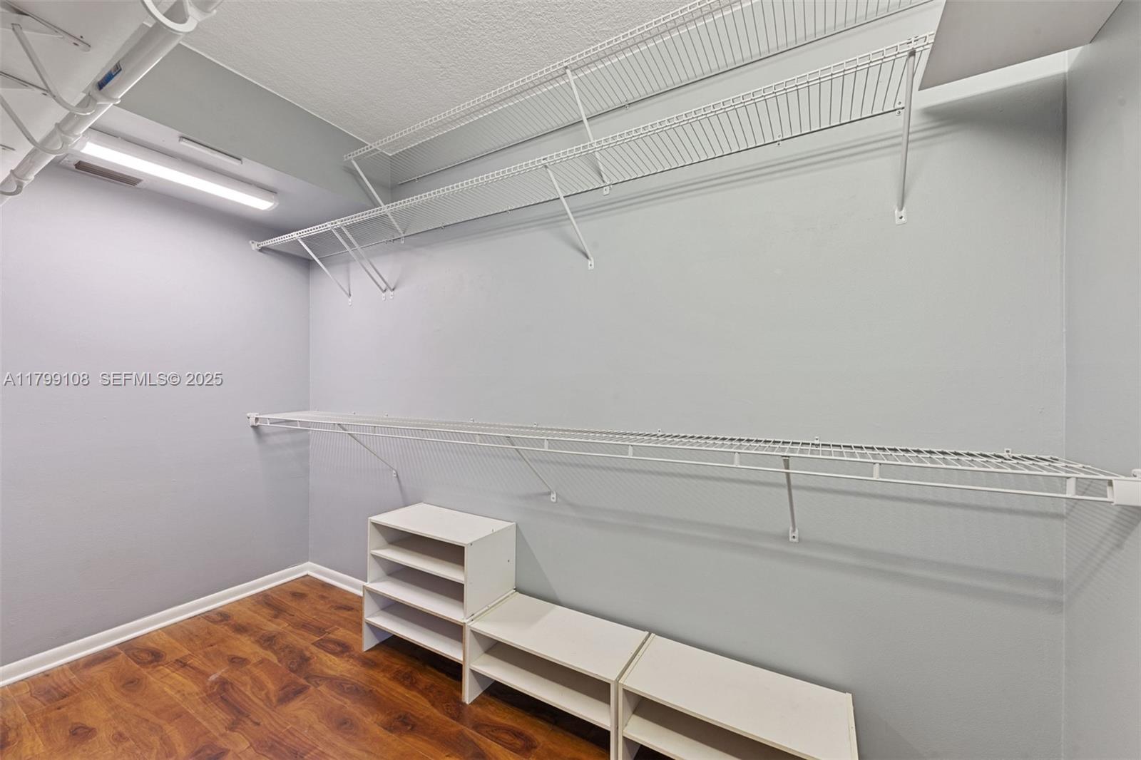 6668 Burning Wood Drive, Unit 166 Boca Raton, FL 33433 - Photo 21 of 27 a view of a room with racks on the wall