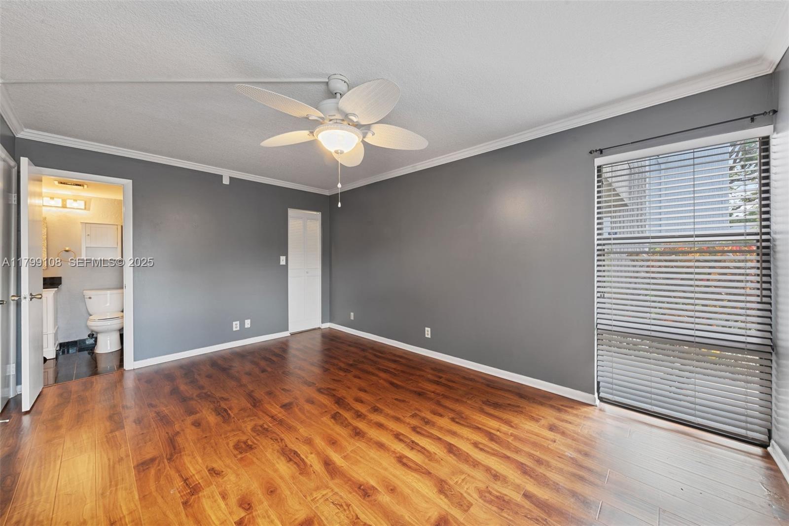 6668 Burning Wood Drive, Unit 166 Boca Raton, FL 33433 - Photo 23 of 27 a view of empty room with wooden floor