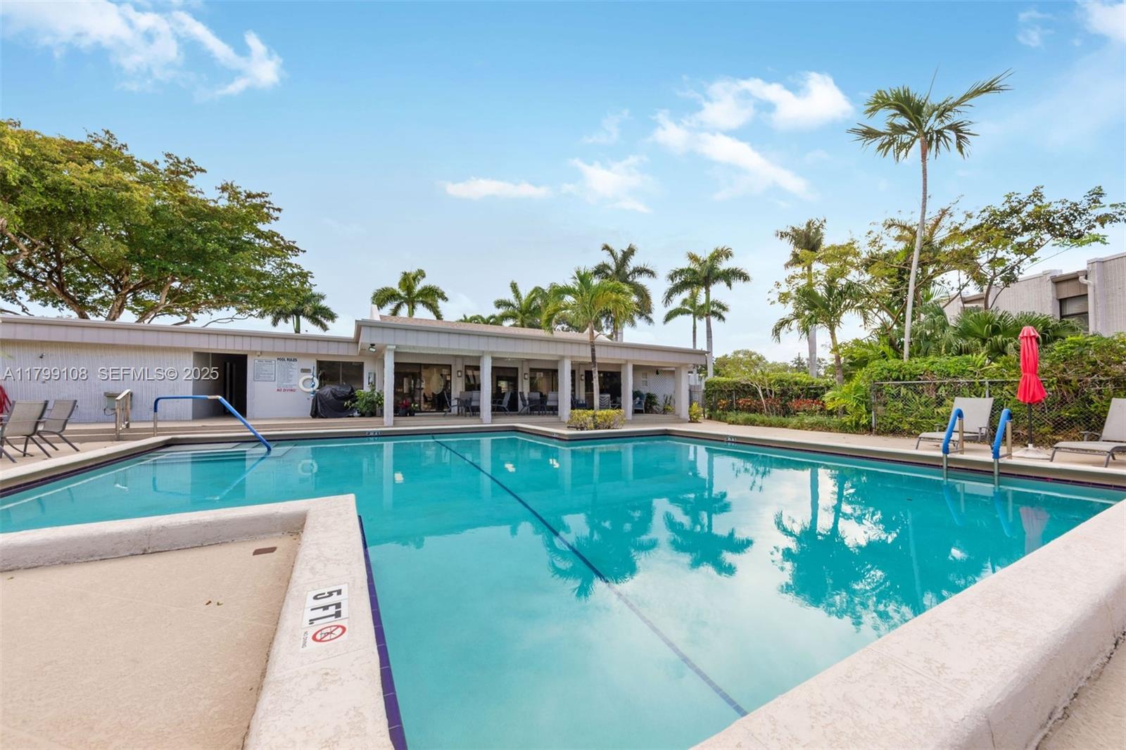 6668 Burning Wood Drive, Unit 166 Boca Raton, FL 33433 - Photo 26 of 27 swimming pool view with a seating space