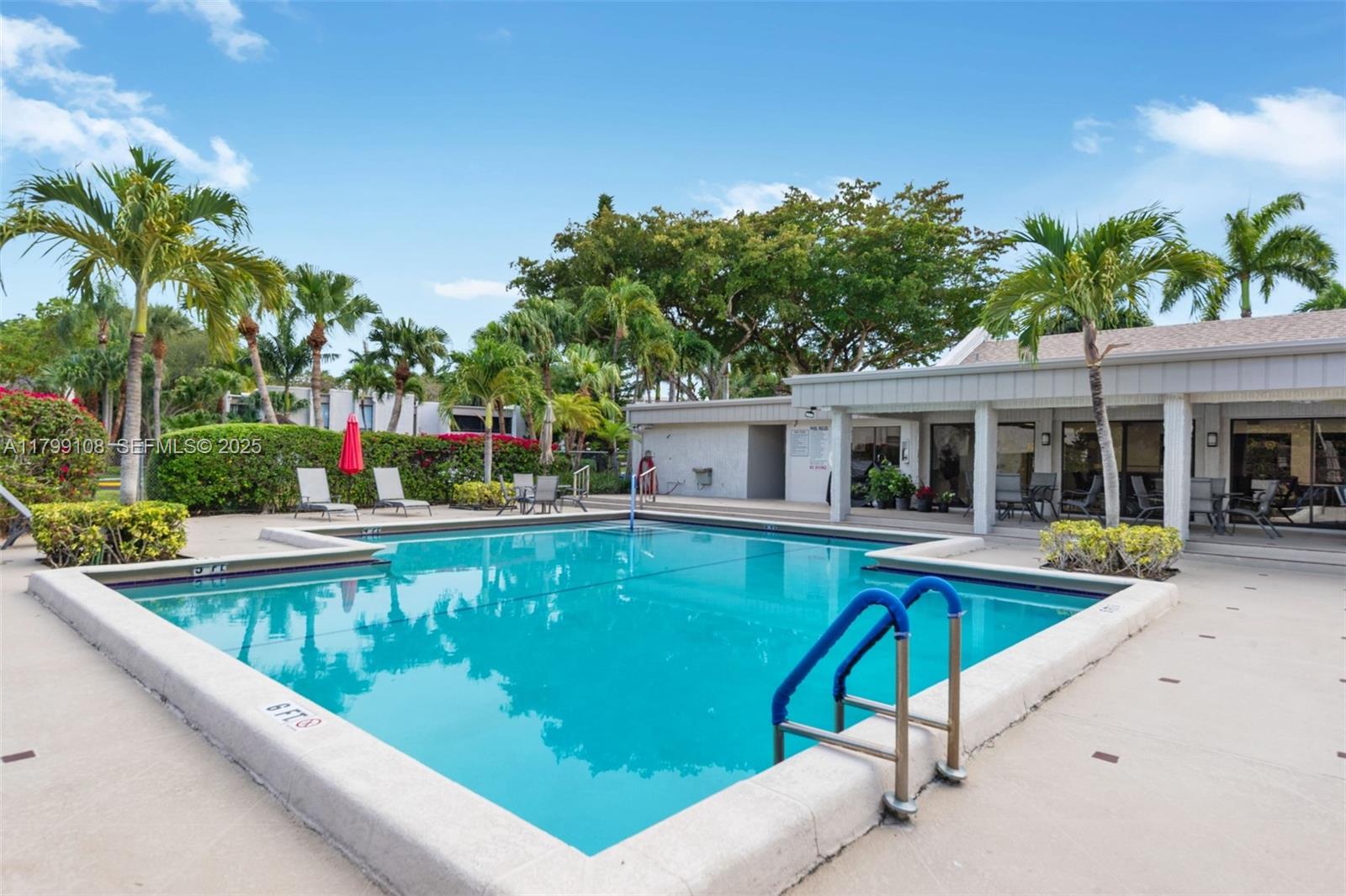 6668 Burning Wood Drive, Unit 166 Boca Raton, FL 33433 - Photo 27 of 27 a view of a house with swimming pool and sitting area