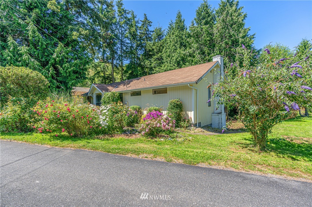 929 Blackburn Road Camano Island, WA 98282 - Photo 1 of 39 a front view of house with yard and green space