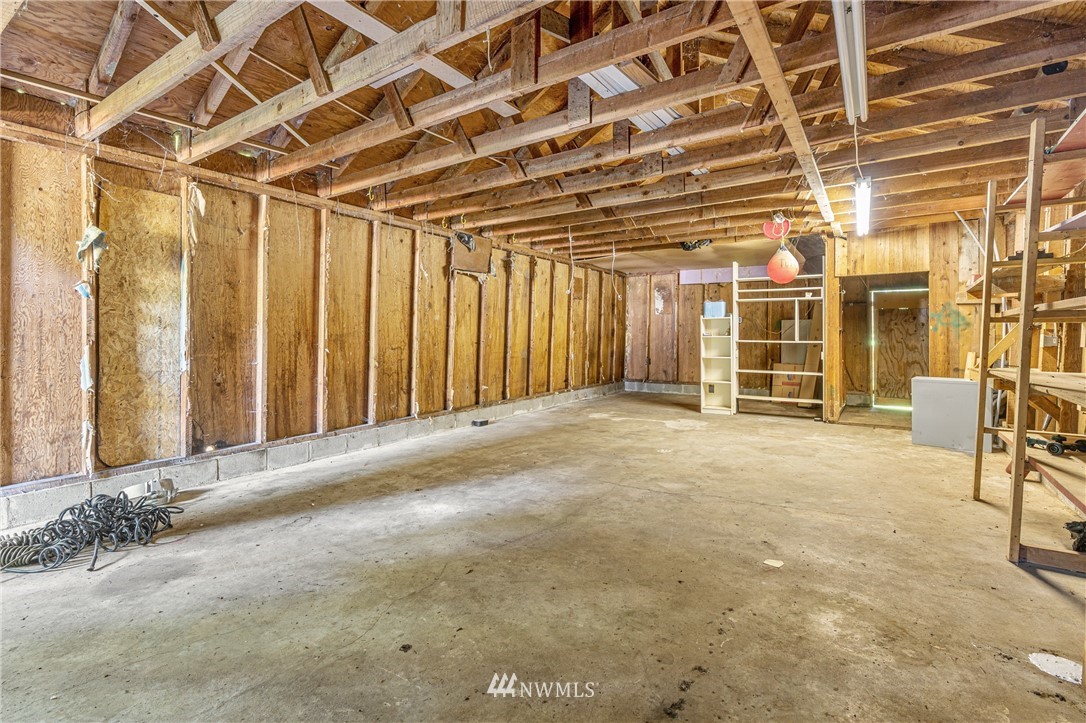 929 Blackburn Road Camano Island, WA 98282 - Photo 13 of 39 a view of a room with wooden walls