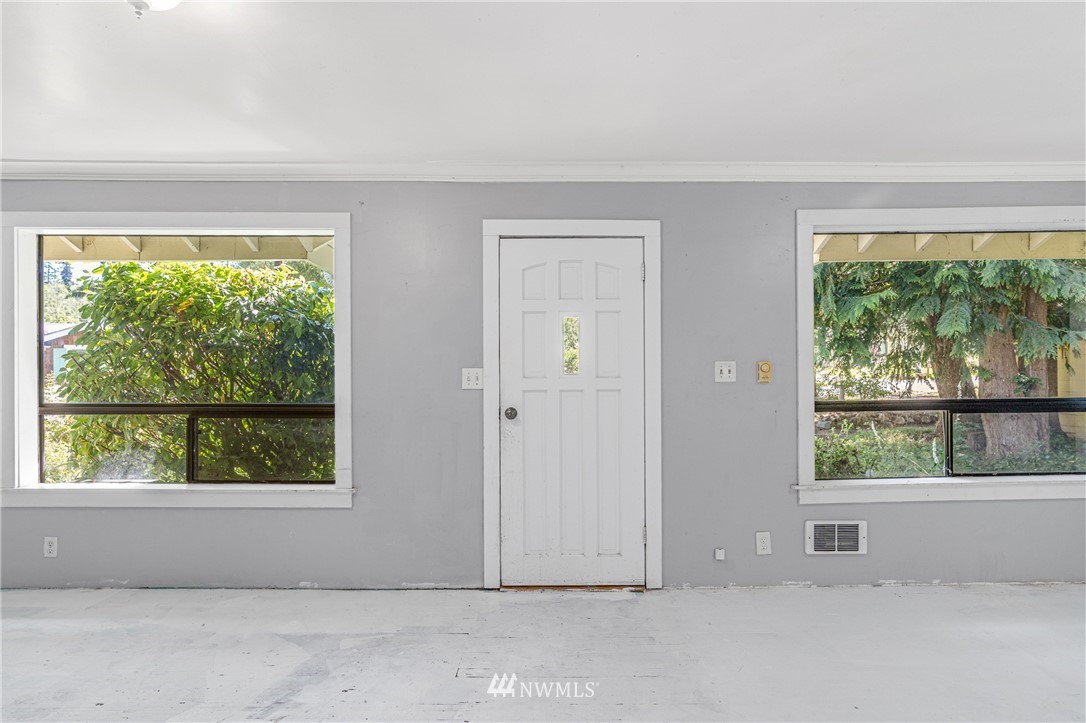 929 Blackburn Road Camano Island, WA 98282 - Photo 15 of 39 an empty room with large windows