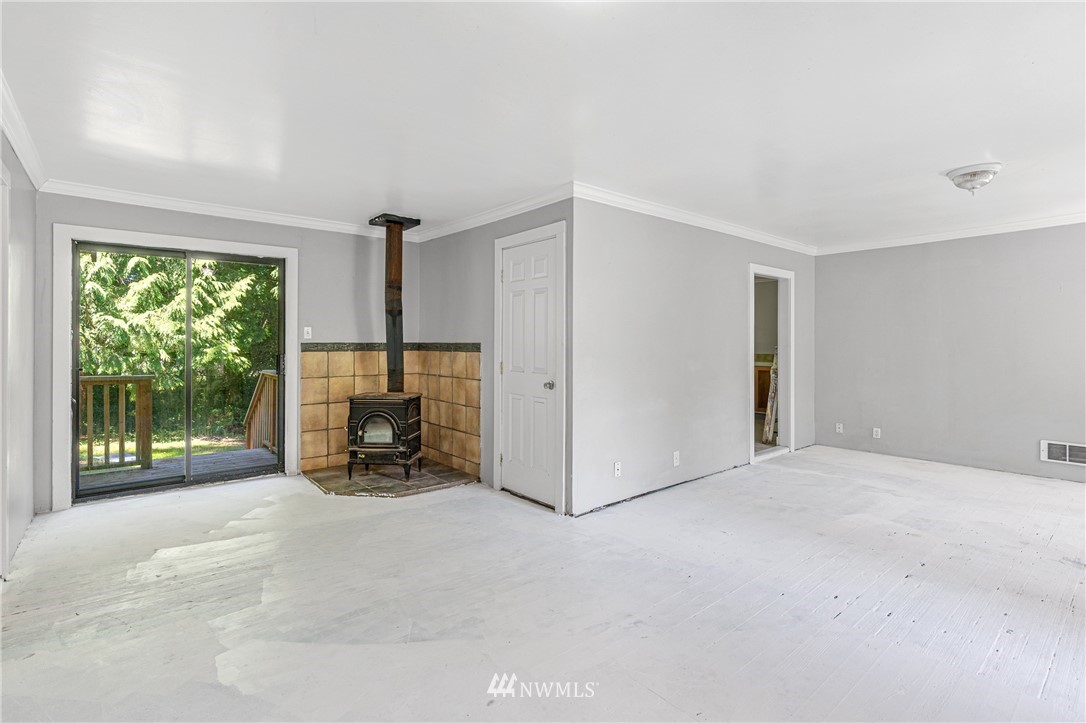 929 Blackburn Road Camano Island, WA 98282 - Photo 20 of 39 a view of a livingroom with furniture and floor to ceiling window