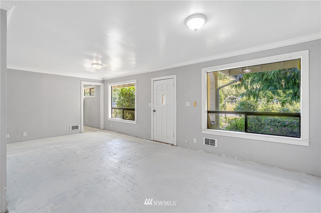 929 Blackburn Road Camano Island, WA 98282 - Photo 23 of 39 an empty room with windows and view