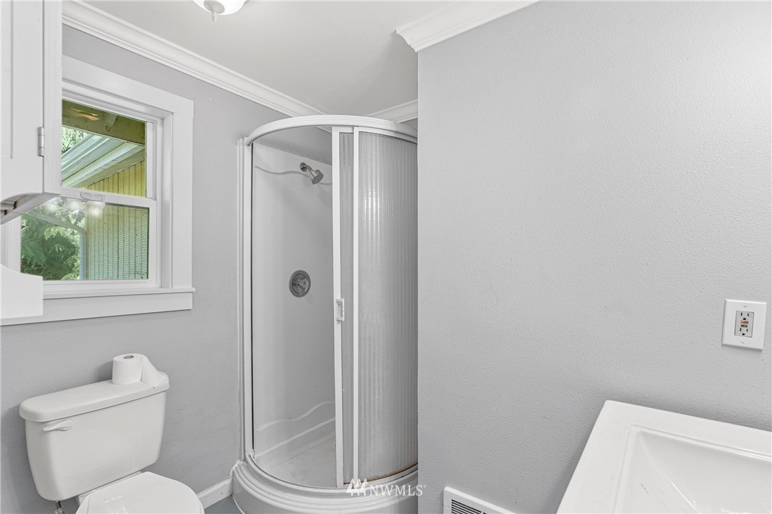 929 Blackburn Road Camano Island, WA 98282 - Photo 29 of 39 a white toilet sitting next to a bathroom sink