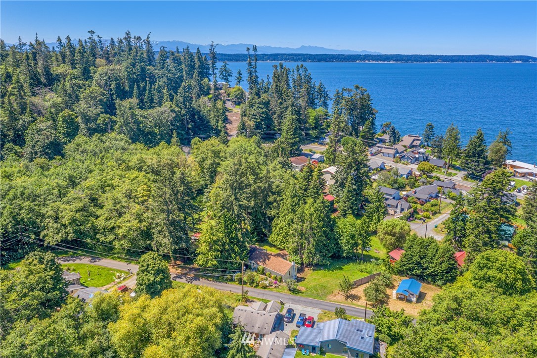 929 Blackburn Road Camano Island, WA 98282 - Photo 4 of 39 a view of a houses with a yard and lake view