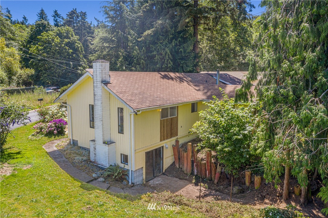 929 Blackburn Road Camano Island, WA 98282 - Photo 6 of 39 a view of a house with yard and plants