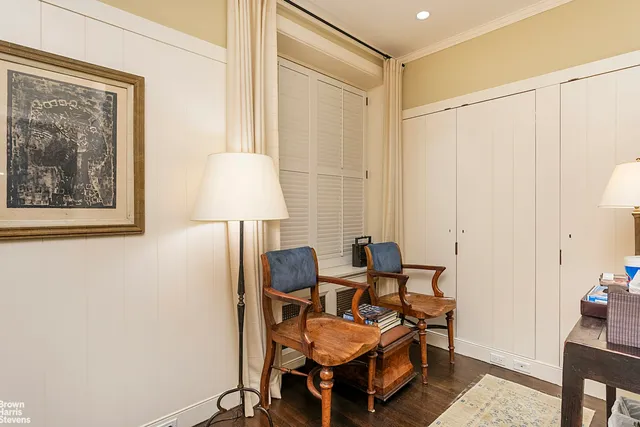 a living room with furniture and a lamp