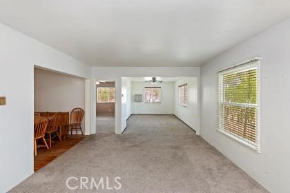 20407 Markham Street Perris, CA 92570 - Photo 12 of 26 a view of livingroom with furniture and windows