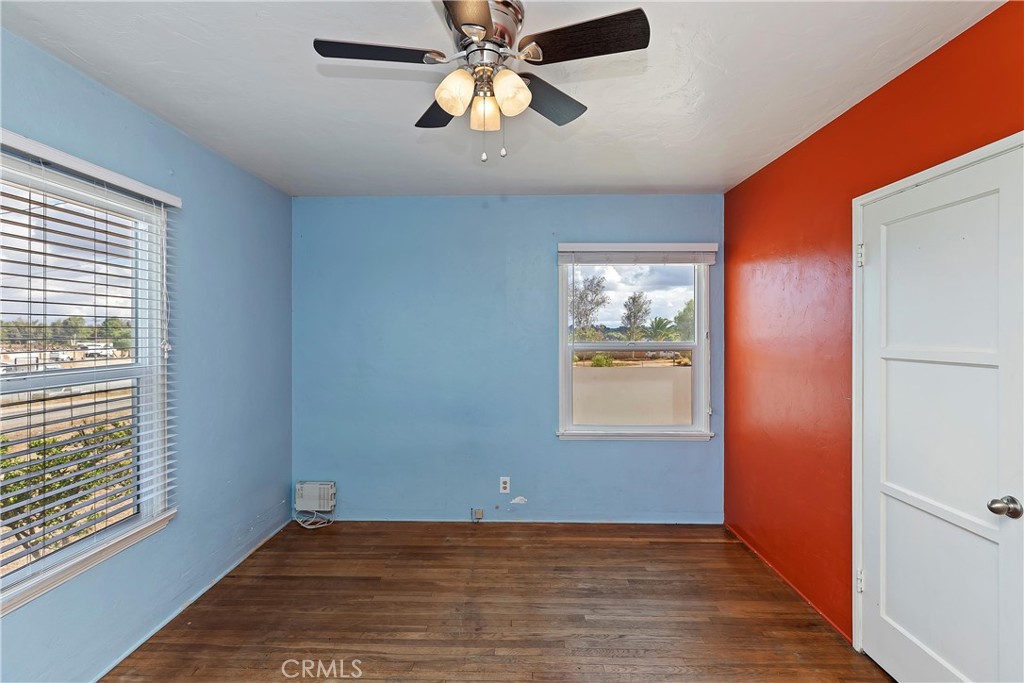 20407 Markham Street Perris, CA 92570 - Photo 17 of 26 wooden floor in an empty room with a window
