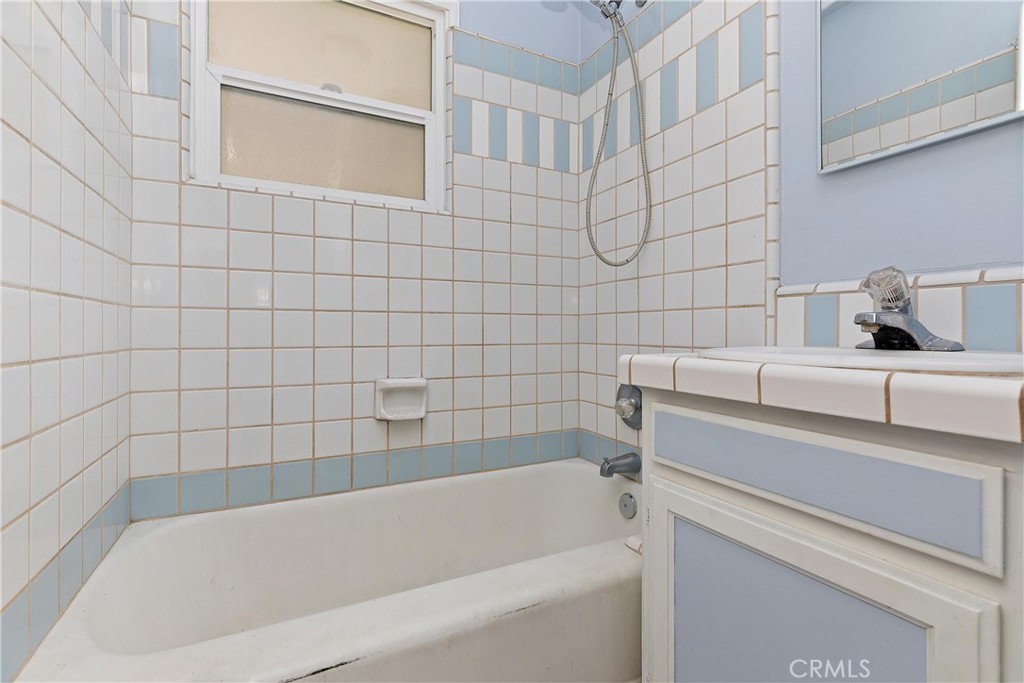 20407 Markham Street Perris, CA 92570 - Photo 19 of 26 a bathroom with a bathtub and sink