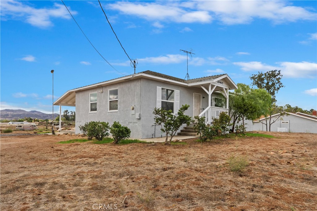 20407 Markham Street Perris, CA 92570 - Photo 21 of 26 a view of a house with a yard