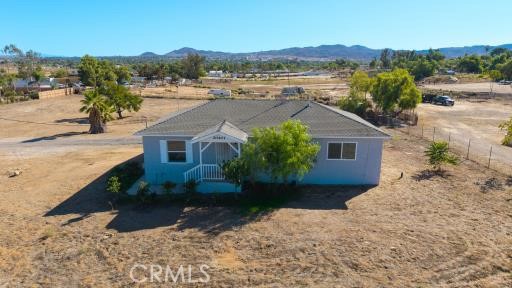 20407 Markham Street Perris, CA 92570 - Photo 3 of 26 a aerial view of a house with a yard and lake view
