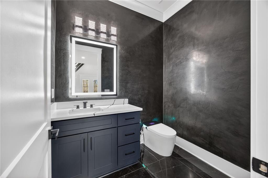 405 Thunder Road Buford, GA 30518 - Photo 48 of 104 a bathroom with a double vanity sink mirror and toilet
