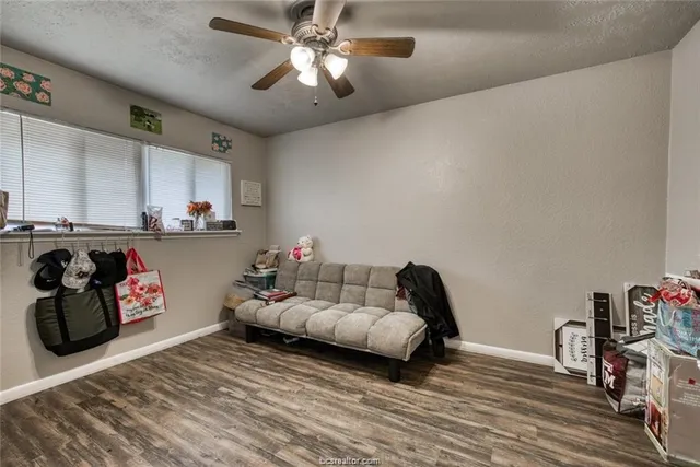 a bedroom with furniture and a chandelier