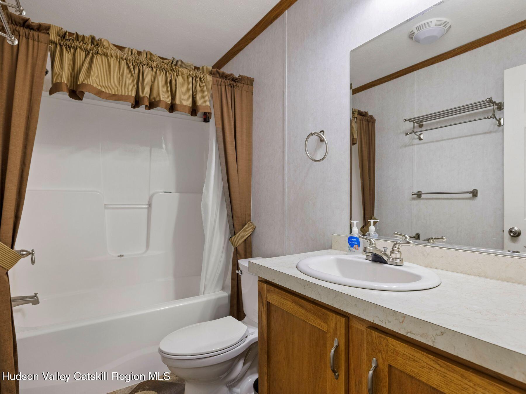 137 Mountain Pond View Road Gilboa, NY 12076 - Photo 31 of 38 a bathroom with a sink a toilet and shower
