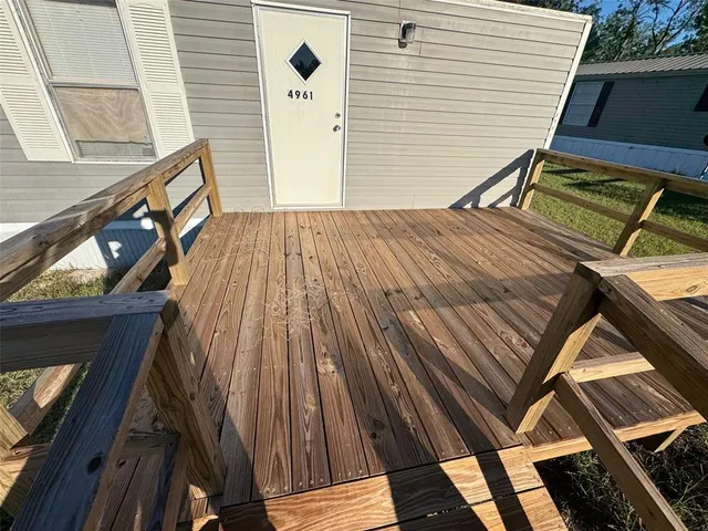 a view of a backyard with sitting area