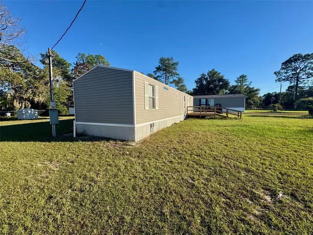 a backyard of a house with lots of green space