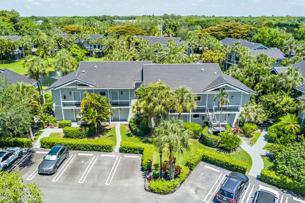 a aerial view of a house with a yard and plants