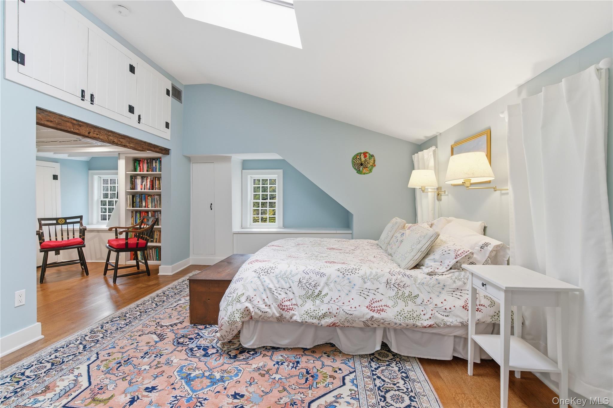 144 West Neck Road Huntington, NY 11743 - Photo 21 of 33 a bedroom with a bed a table and chair