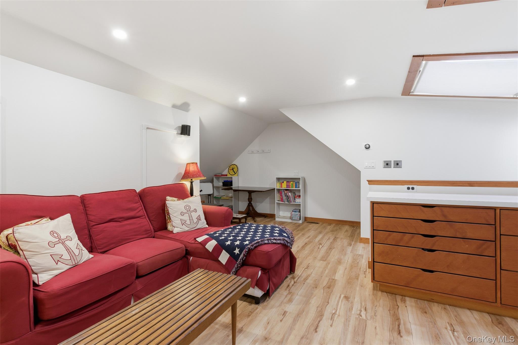 144 West Neck Road Huntington, NY 11743 - Photo 24 of 33 a living room with furniture a ceiling fan and a rug