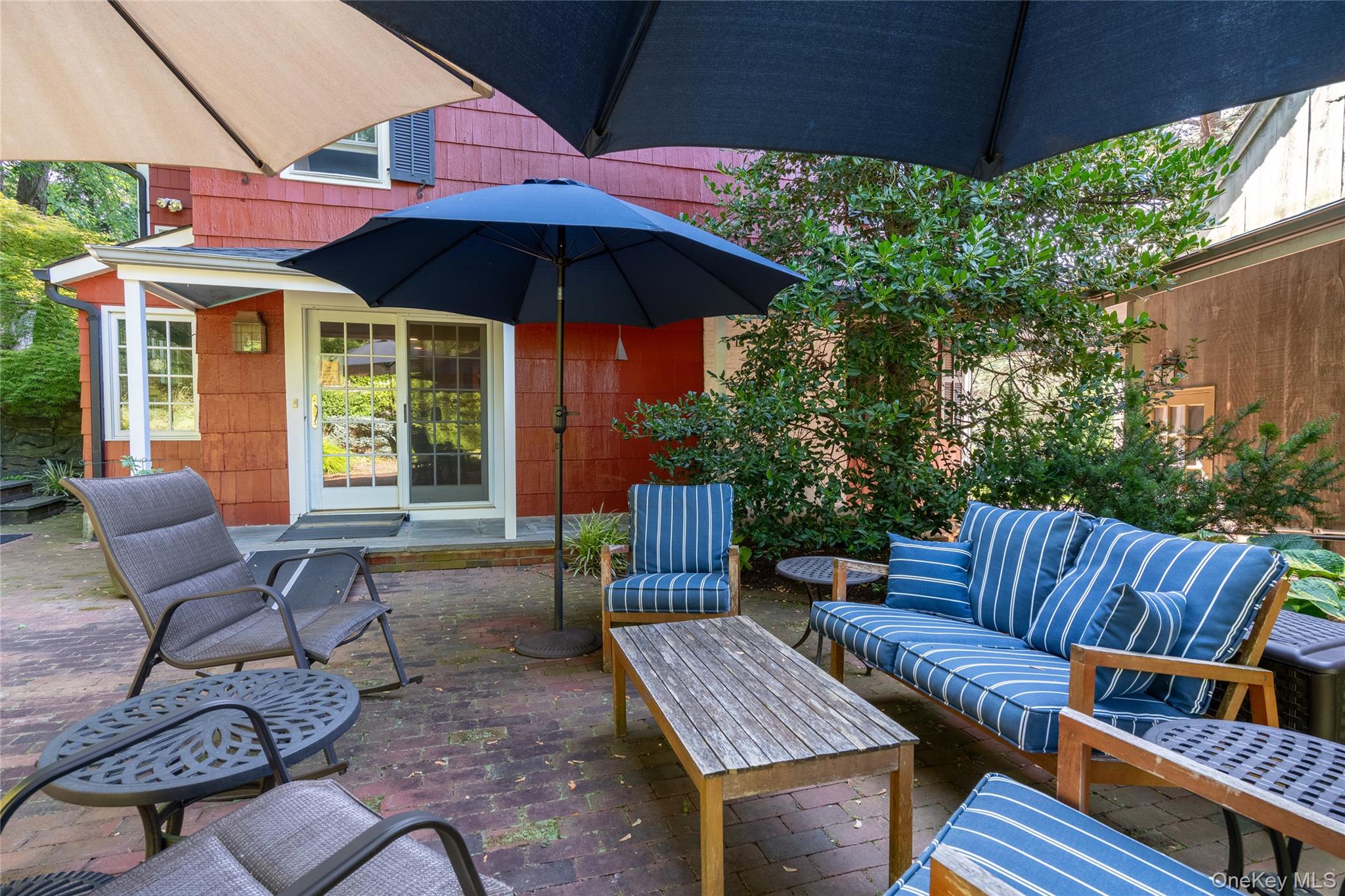 144 West Neck Road Huntington, NY 11743 - Photo 25 of 33 a view of an outdoor sitting area with furniture and umbrella