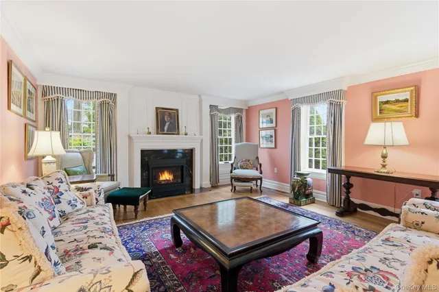 a view of a dining room with furniture and a chandelier