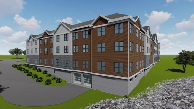a view of a brick house with a yard and potted plants