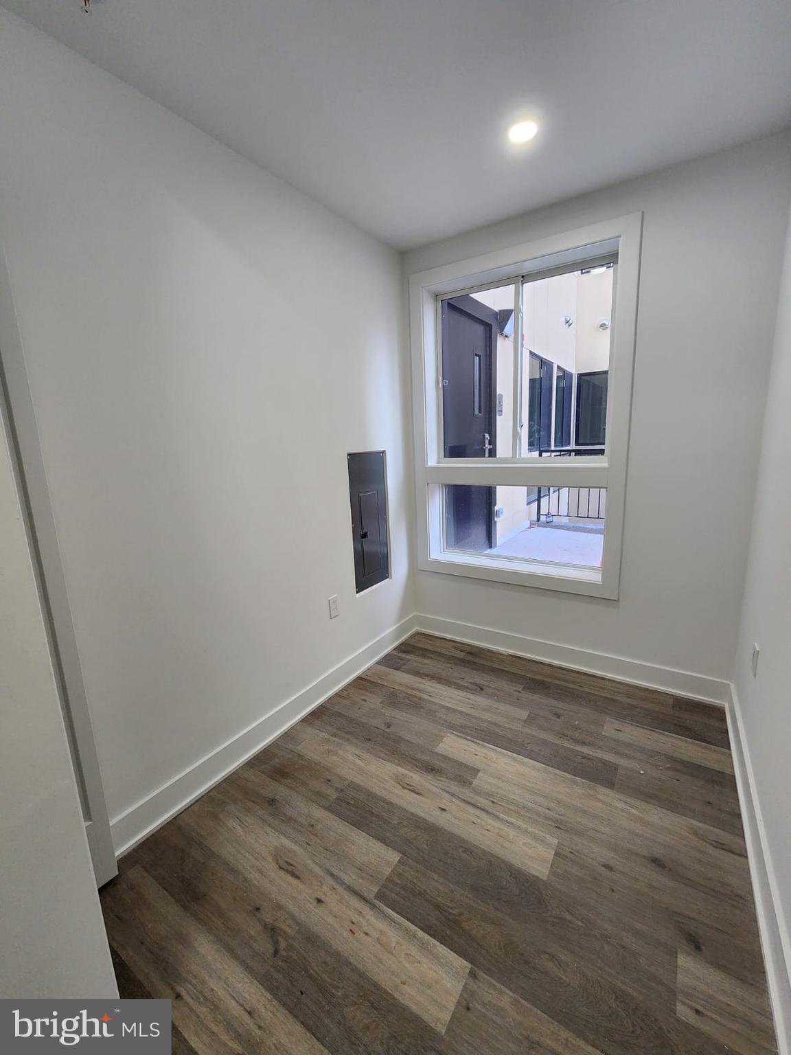 4905 Georgia Avenue Northwest, Unit 105 Washington, DC 20011 - Photo 16 of 18 a view of empty room with wooden floor