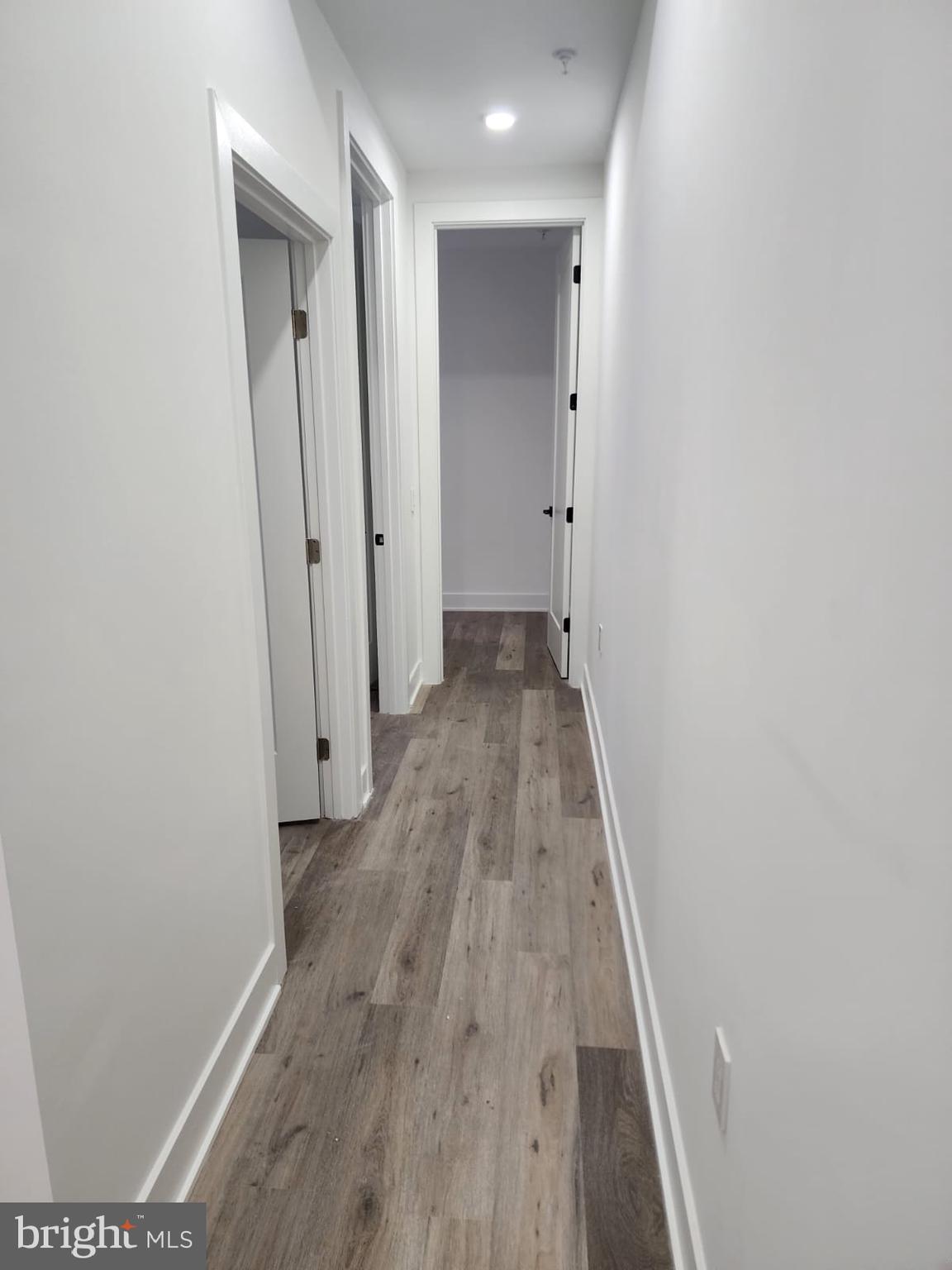 4905 Georgia Avenue Northwest, Unit 105 Washington, DC 20011 - Photo 10 of 18 a view of a hallway with wooden floor