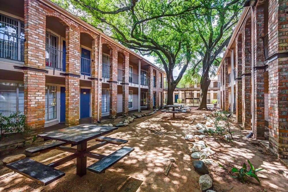 480 West Parker Road, Unit 65 Houston, TX 77091 - Photo 9 of 15 a view of a building with a tree