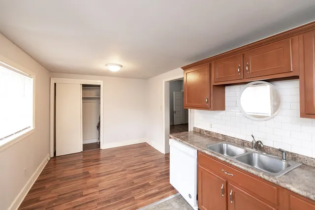 a kitchen with stainless steel appliances granite countertop a sink stove and cabinets