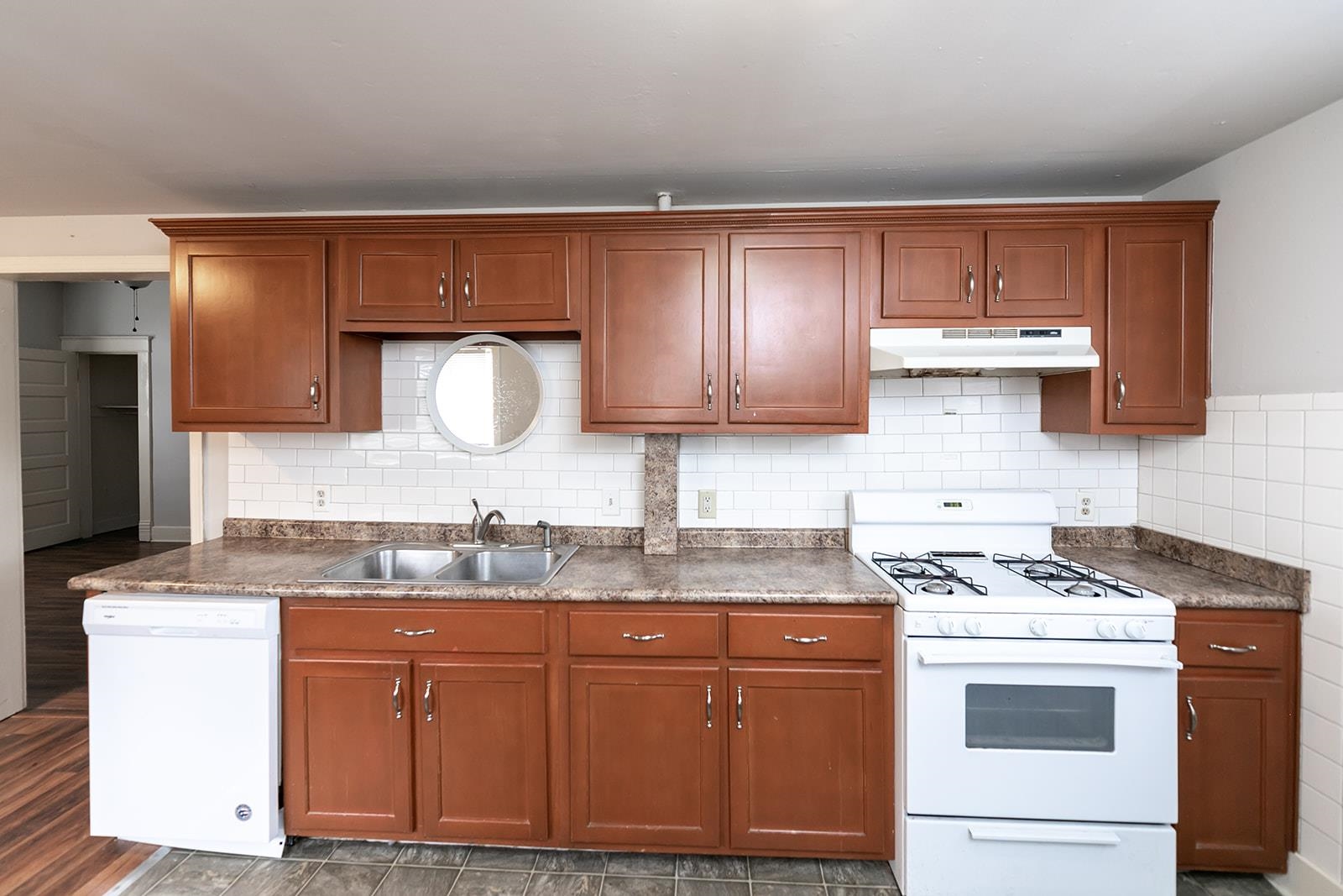 1515 Madison Avenue Memphis, TN 38104 - Photo 13 of 19 a kitchen with stainless steel appliances granite countertop a sink stove and cabinets