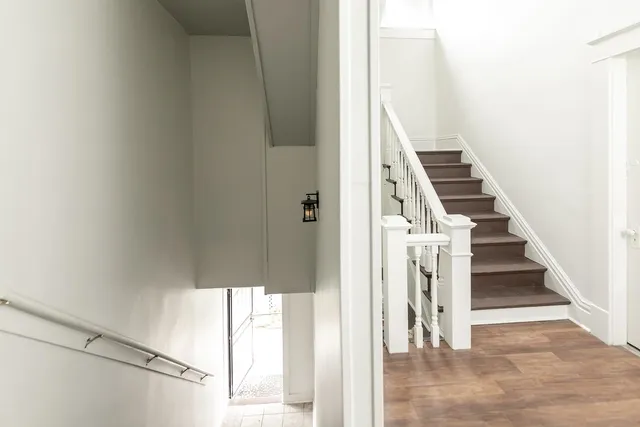 a view of entryway with wooden floor